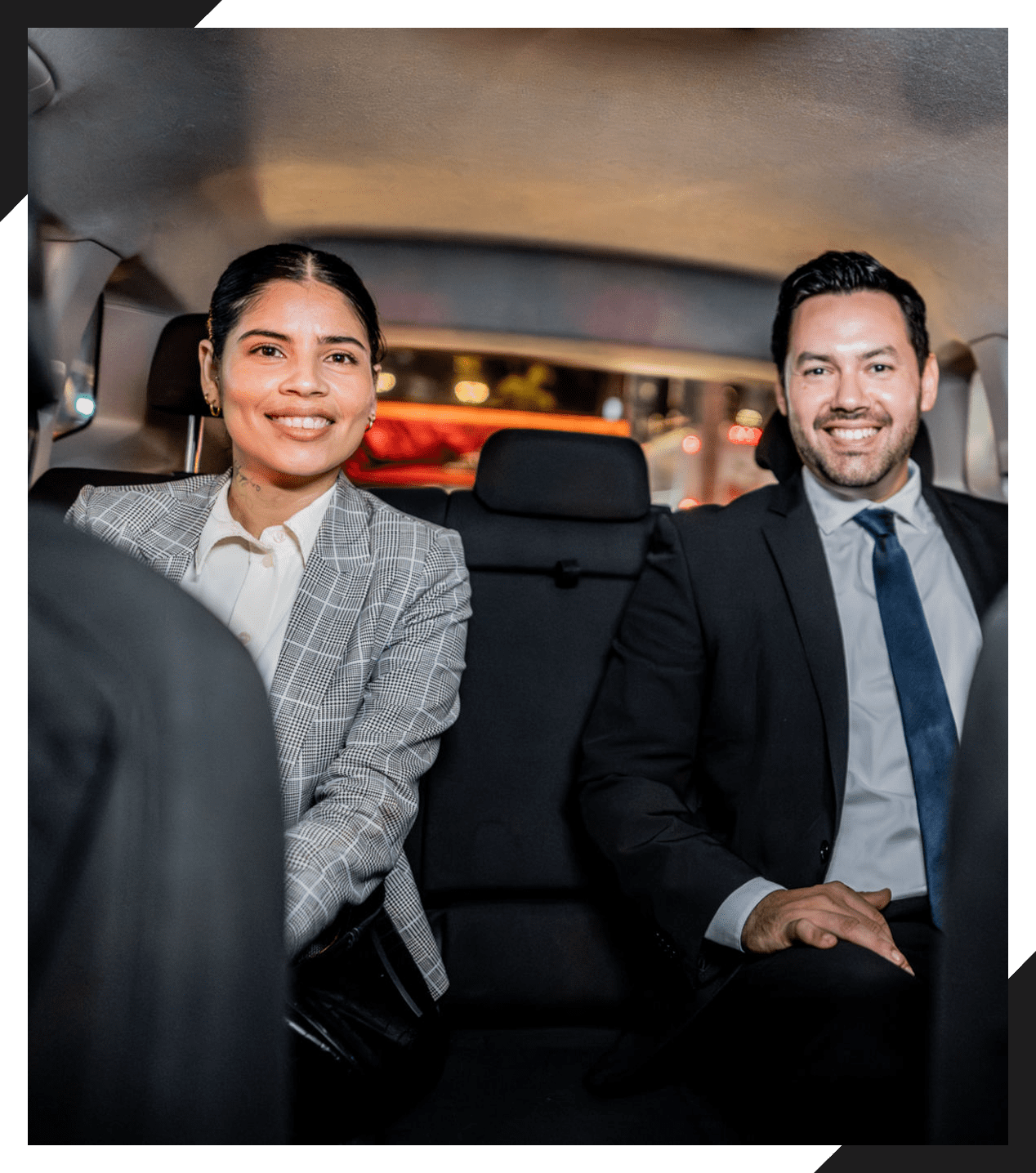 Business professionals sitting in a car